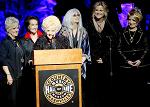 Connie Smith, Brenda Lee, Emmylou Harris, Trisha Yearwood, and Jeannie Seely during Dottie West's induction into the Country Music Hall of Fame on October 21, 2018